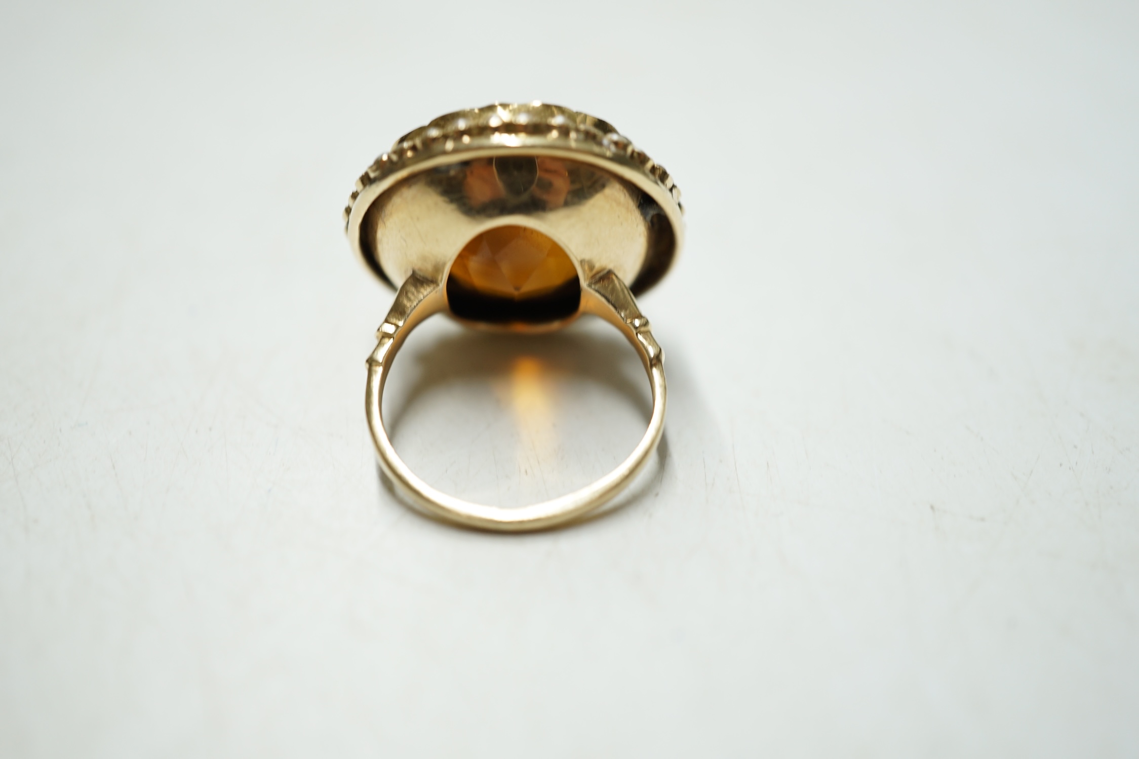 A yellow metal, citrine and seed pearl cluster set circular dress ring, size L, gross weight 10.8 grams. Condition - fair